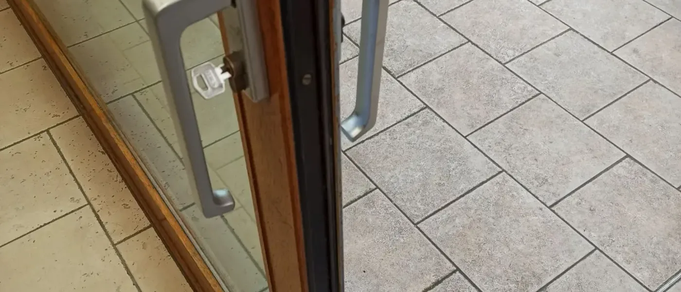 Premium aluminum bifold door system being serviced in a modern London kitchen extension