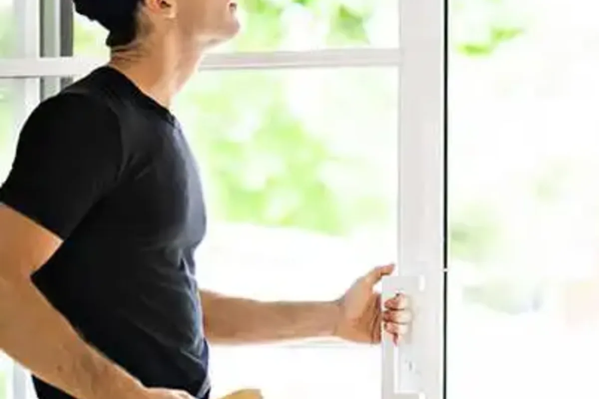 Real sliding door repair job in London — SDR specialist working on track and roller mechanism on-site